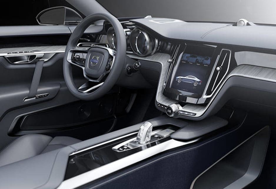 The blue-grey exterior is echoed on the inside of the Coupe. Refined, handcrafted elements such as the leather instrument panel, inlays made of naturally aged wood and the dark blue woven carpets are blended with beautifully machined metal details.