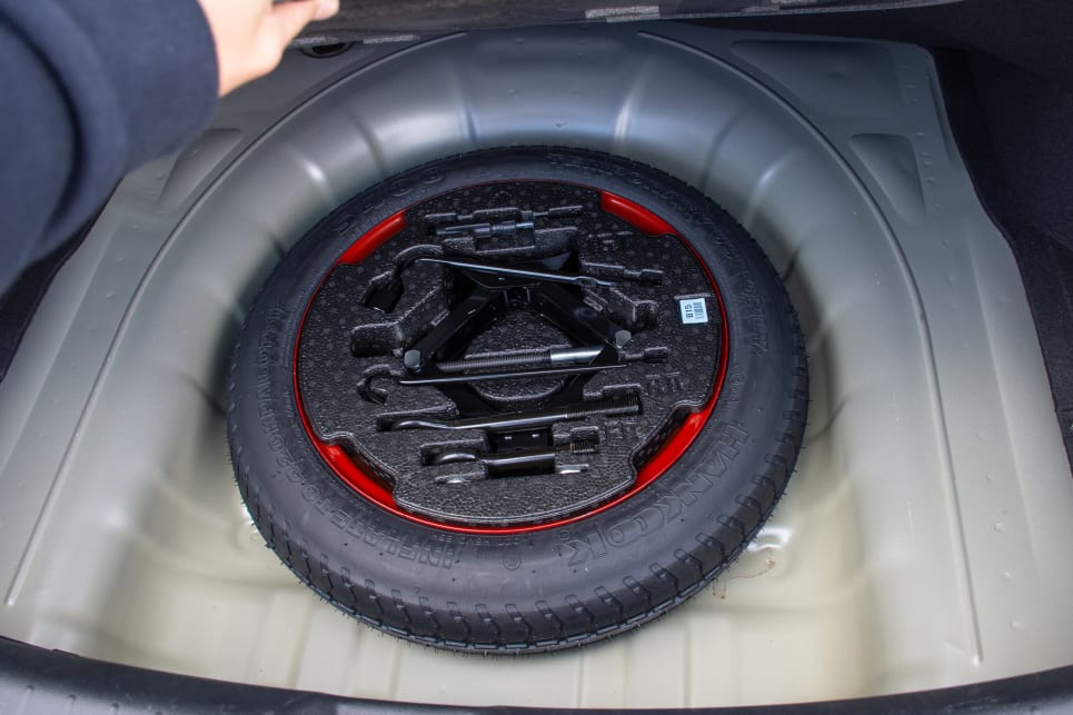 Under the boot floor you'll find a space saver spare wheel.