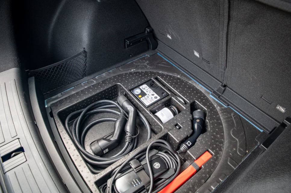 Under the boot floor is storage for the charging cables. (image credit: Tom White)