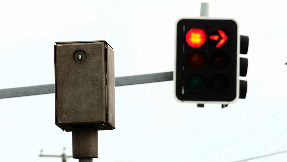 Is it Legal to Drive Through a Red Light to Make Way for a Police or